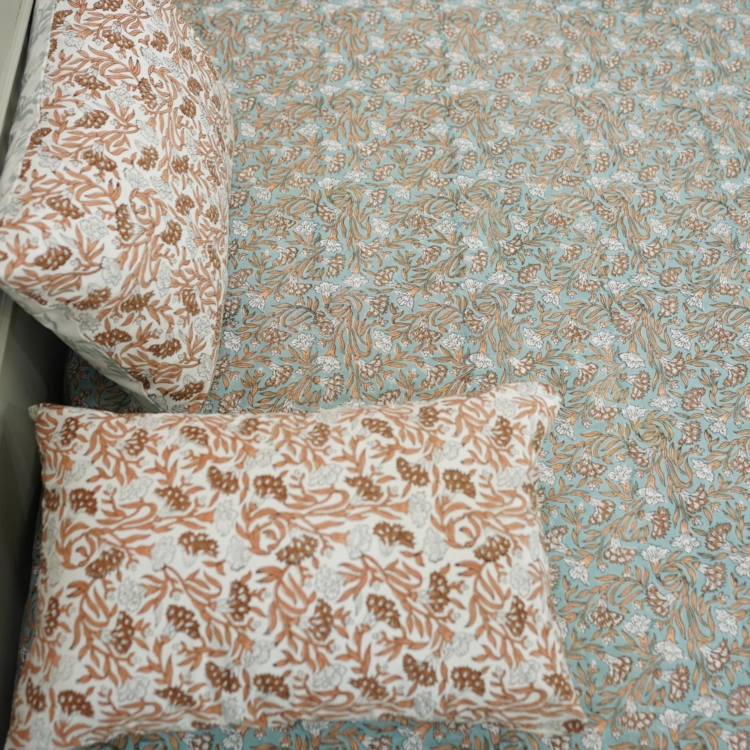 Our floral hand block printed bedsheet brings together soft cotton texture and artisan elegance. The accompanying pillow covers complete this restful, charming bedroom look.