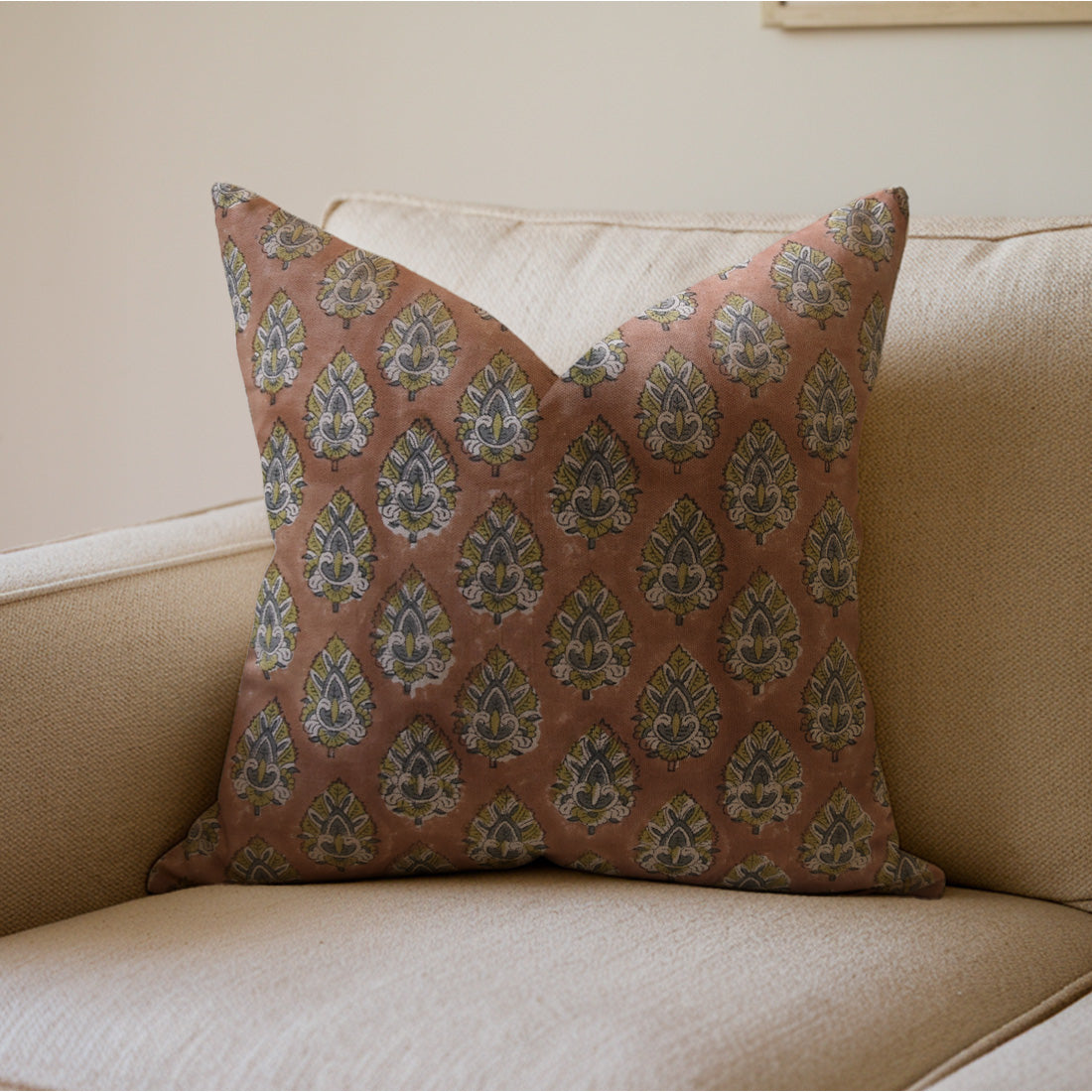 Brown pillow with a floral pattern