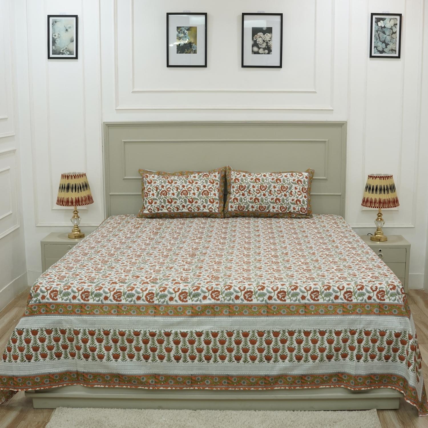 Rich in tradition and texture, this cotton bedsheet features detailed floral block prints. Accompanied by coordinating pillow covers, it reflects the charm of artisan-crafted bed linen made with care and heritage.
