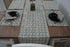 Gray block print table cloth elegantly set on a wooden dining table