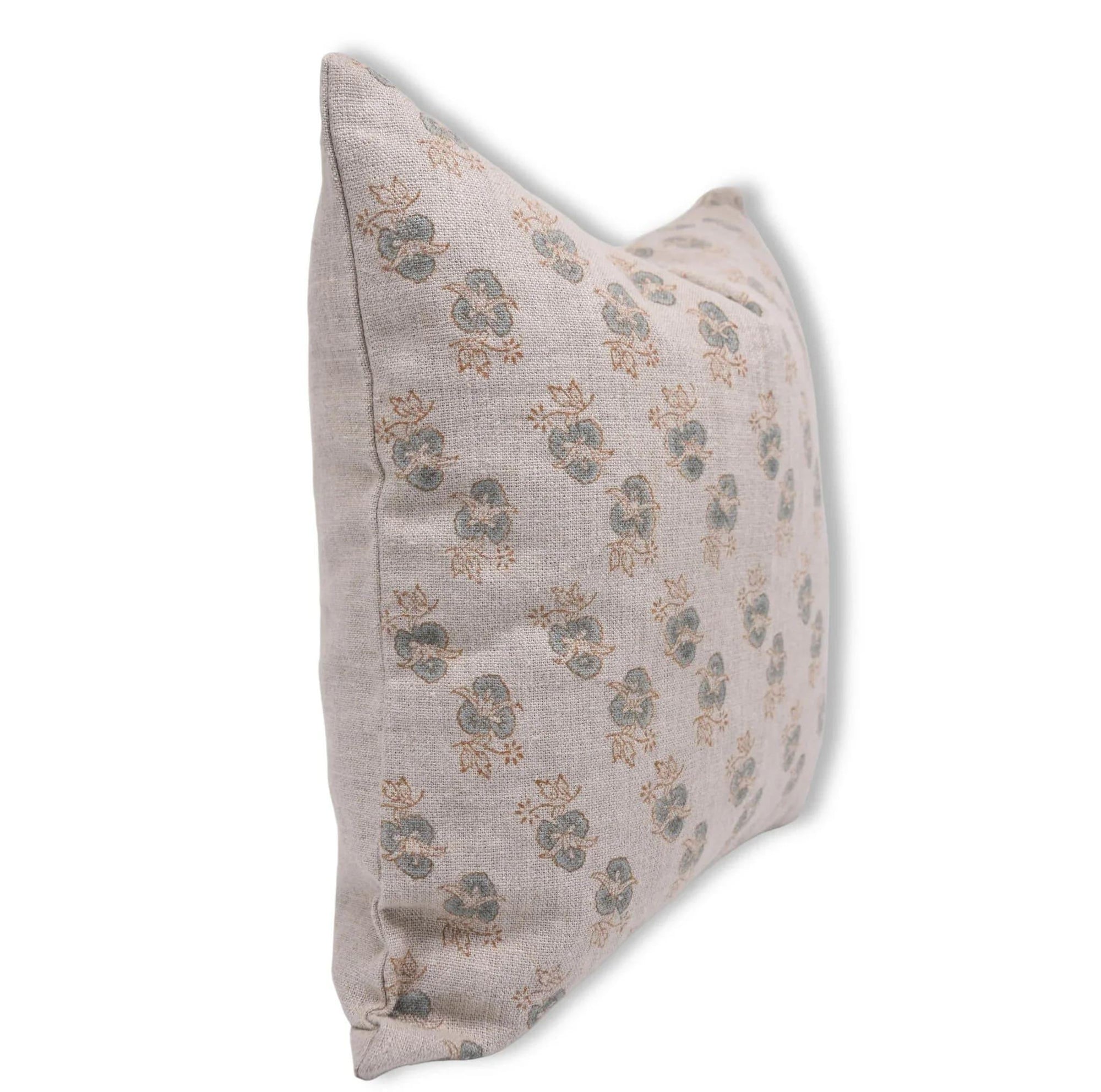 Decorative pillow with floral pattern on a white background