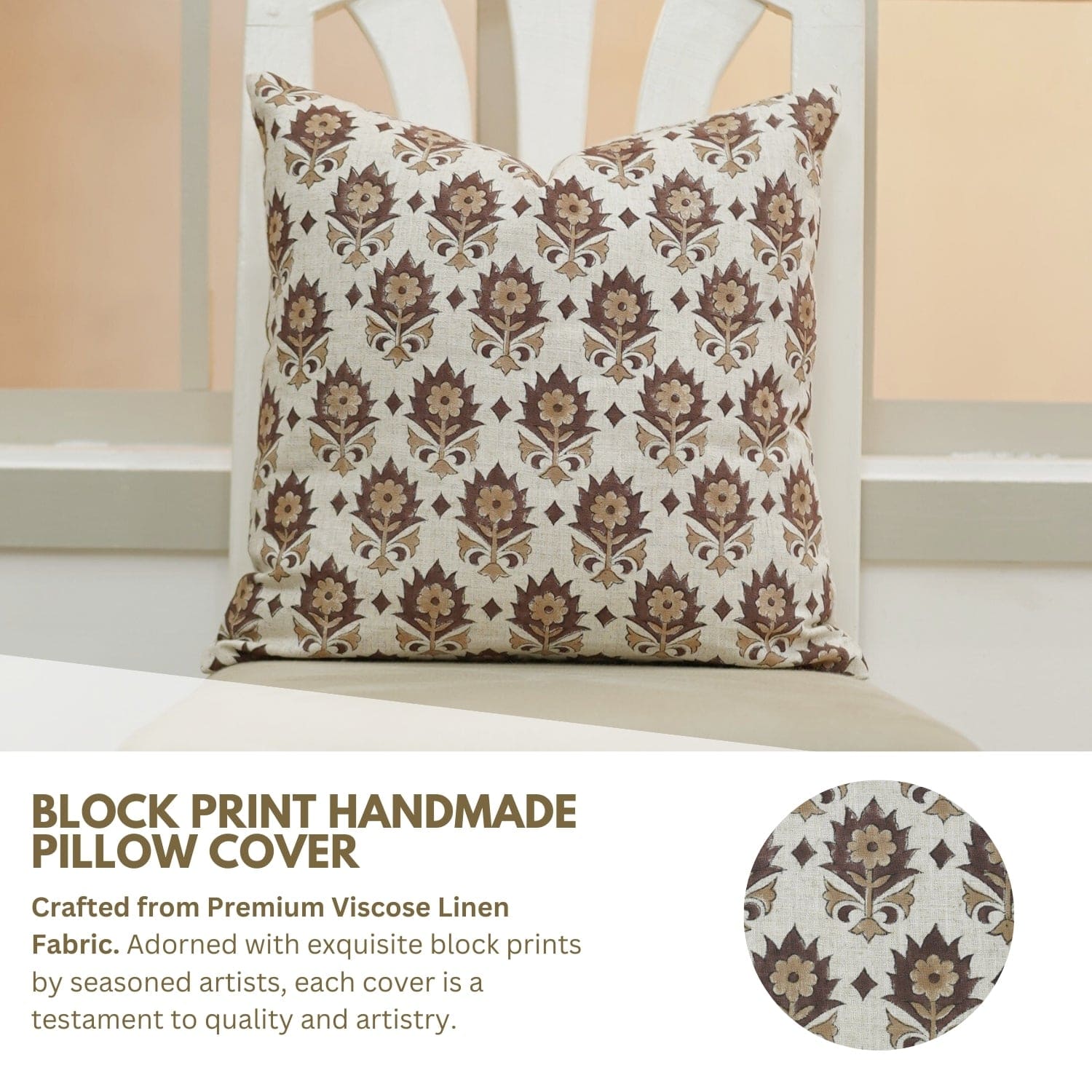 Decorative pillow cover with block print pattern on a white chair.