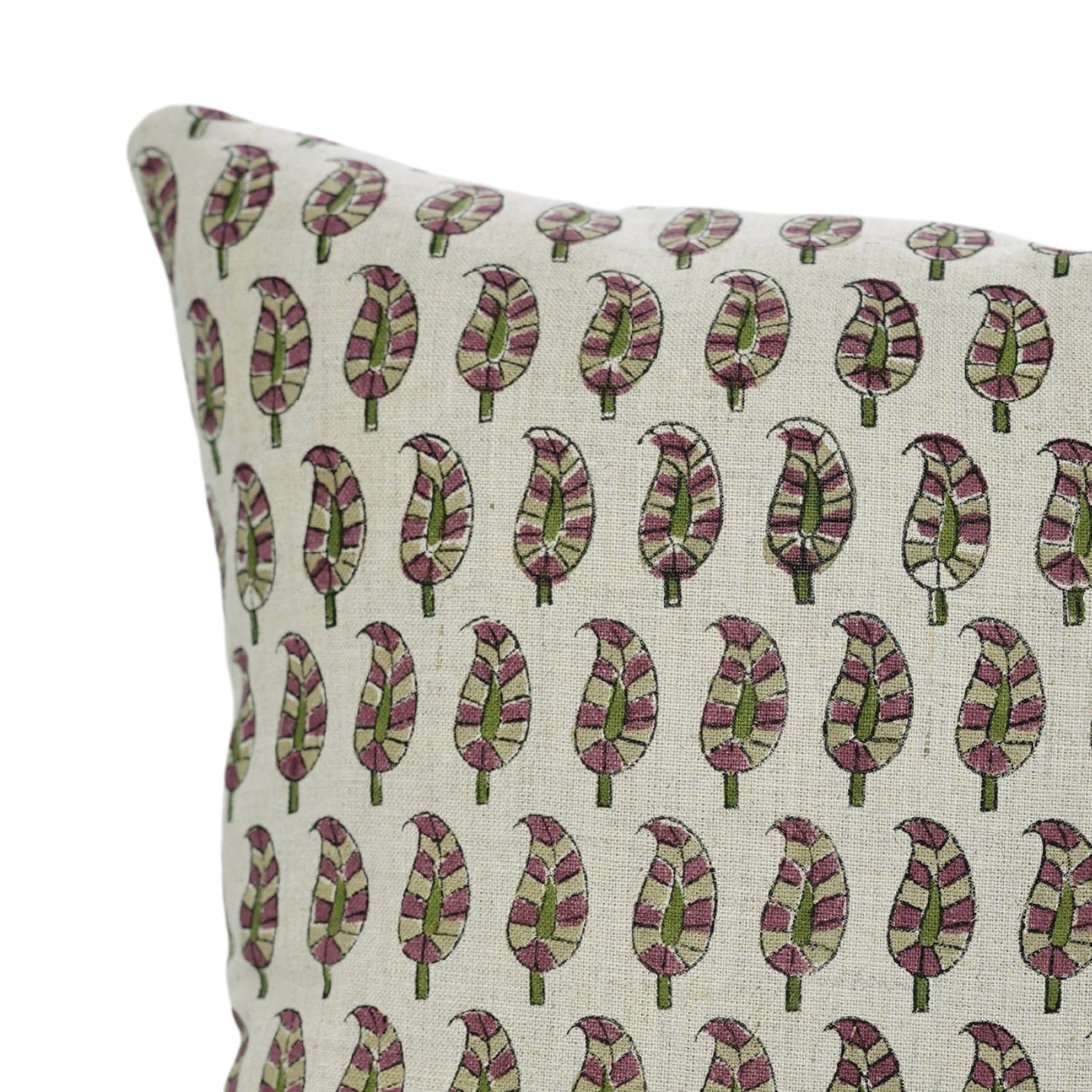 White cushion featuring block printed leaf design