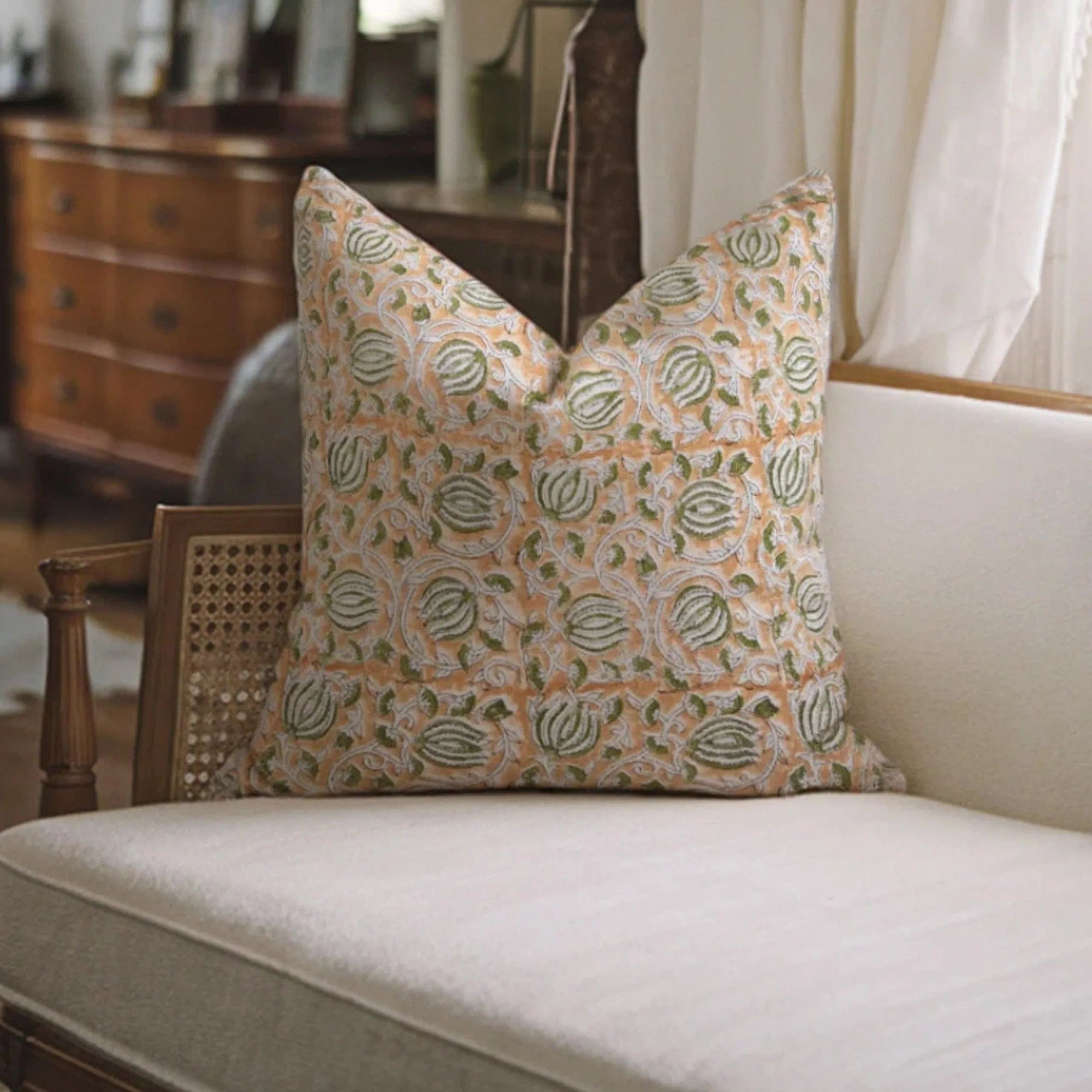Decorative pillow with a floral pattern on a white sofa