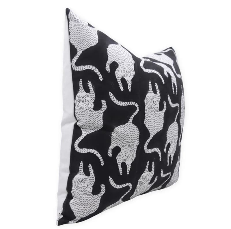 Decorative pillow with black and white elephant pattern on a white background