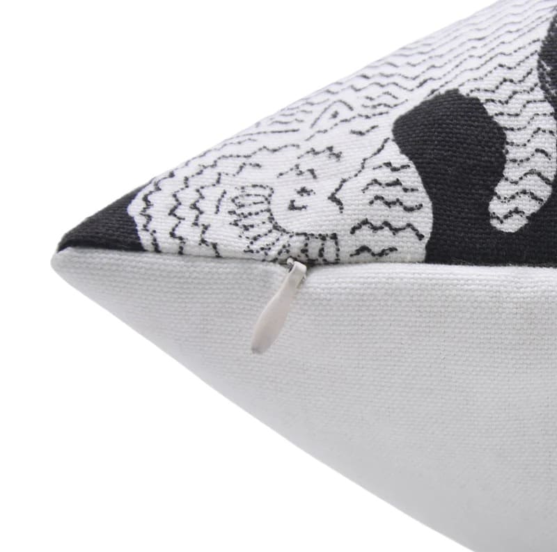 Close-up of a decorative pillow with black and white pillow cover with invisble  zipper