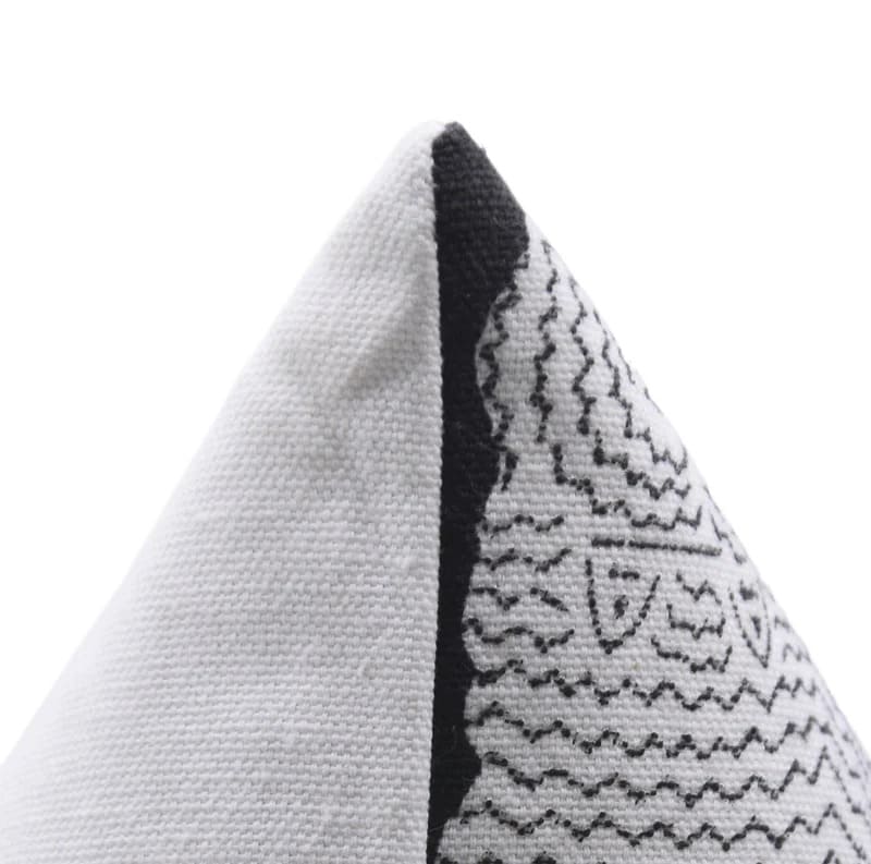Textured fabric with black and white pattern on a white background