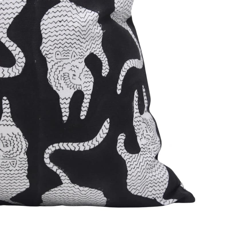 Black and white patterned fabric with abstract designs on a white background