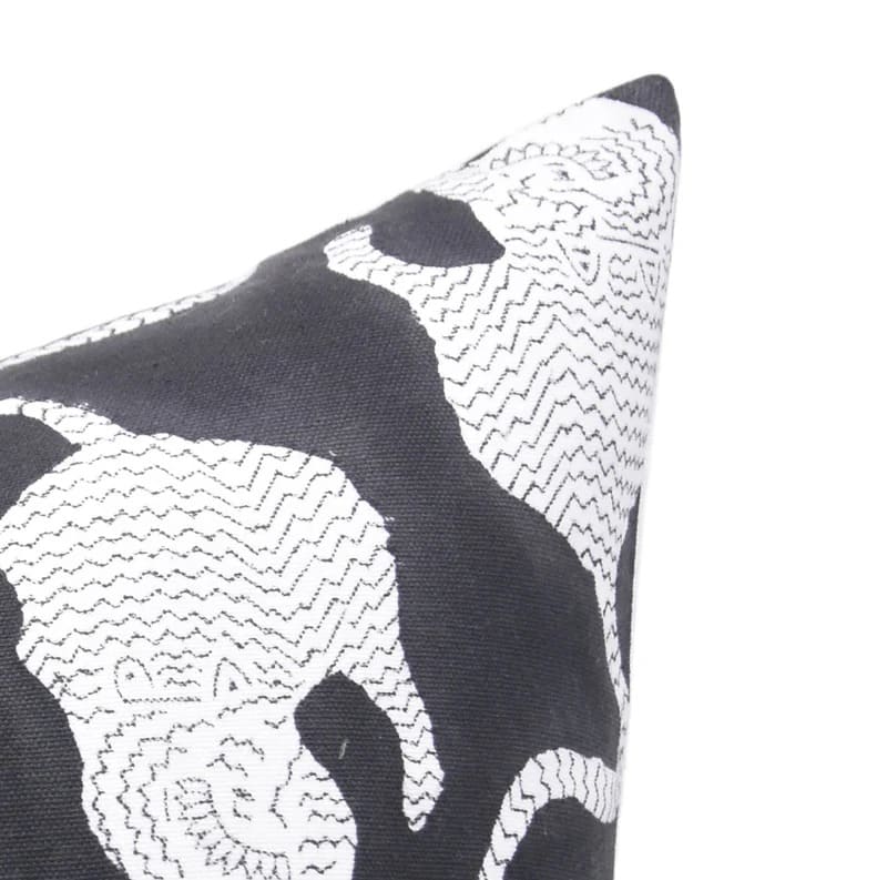 Black and white patterned pillow on a white background