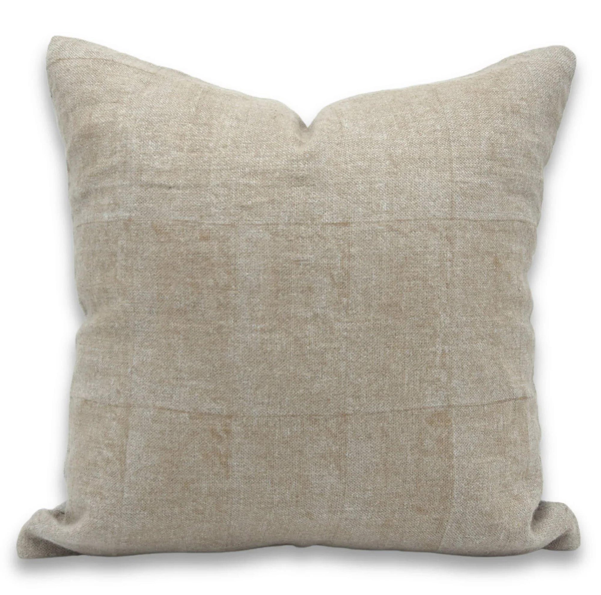 Beige pillow on a white background