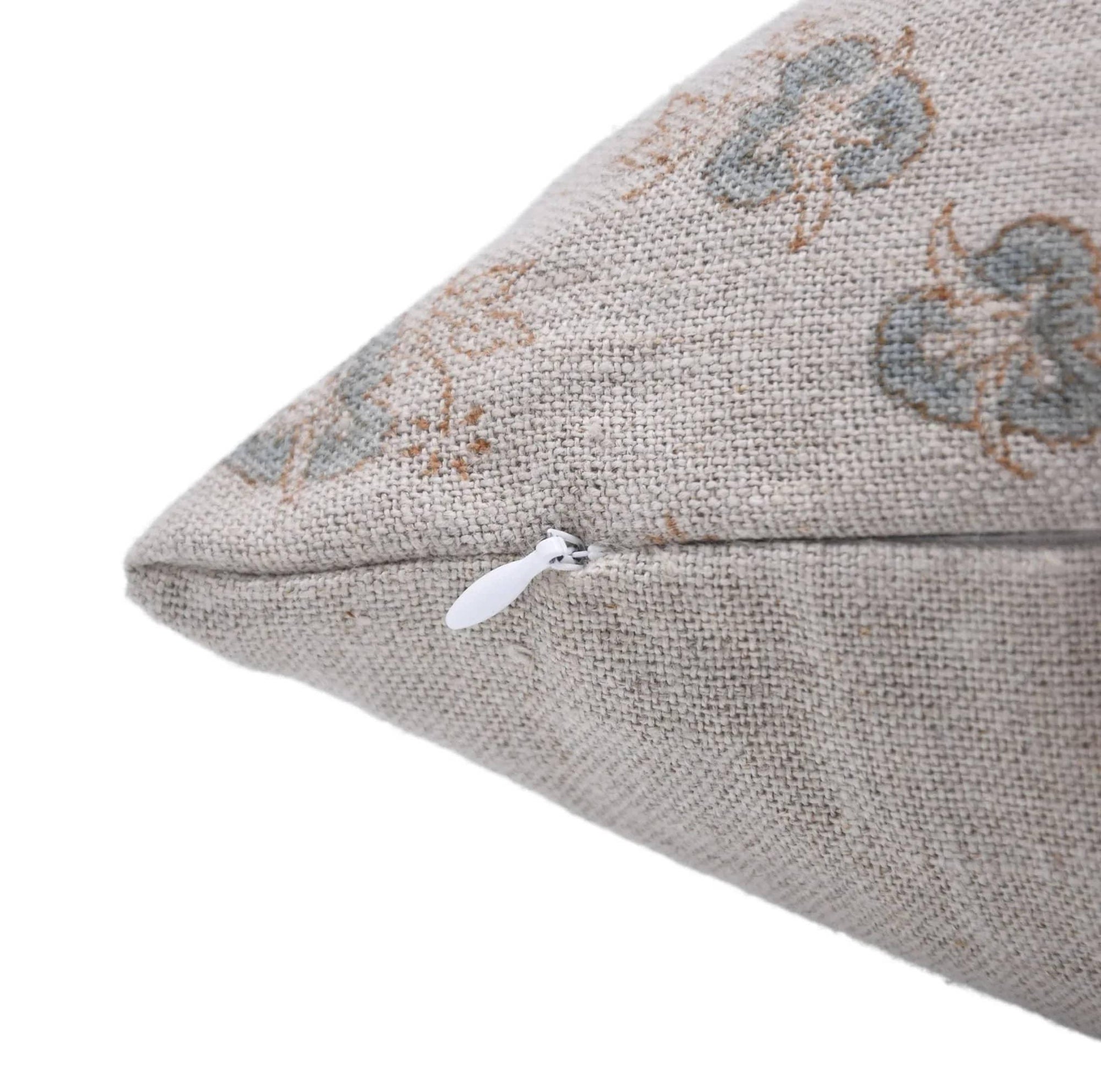 Textured pillow with floral pattern on a white background