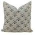 Decorative pillow with floral pattern on a light gray background