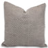 Patterned pillow on a beige linen cover