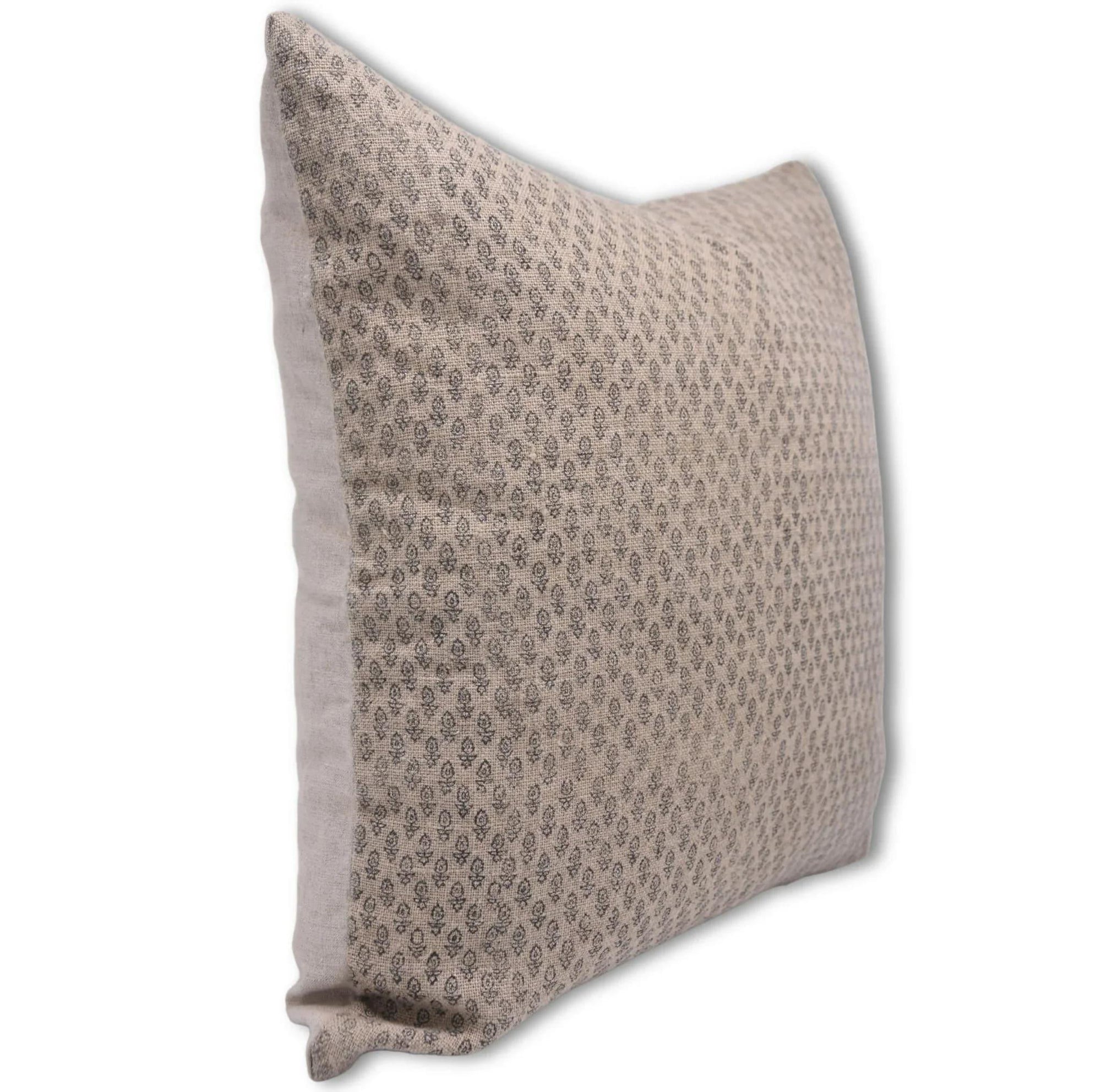 Decorative pillow with a subtle pattern on a white background