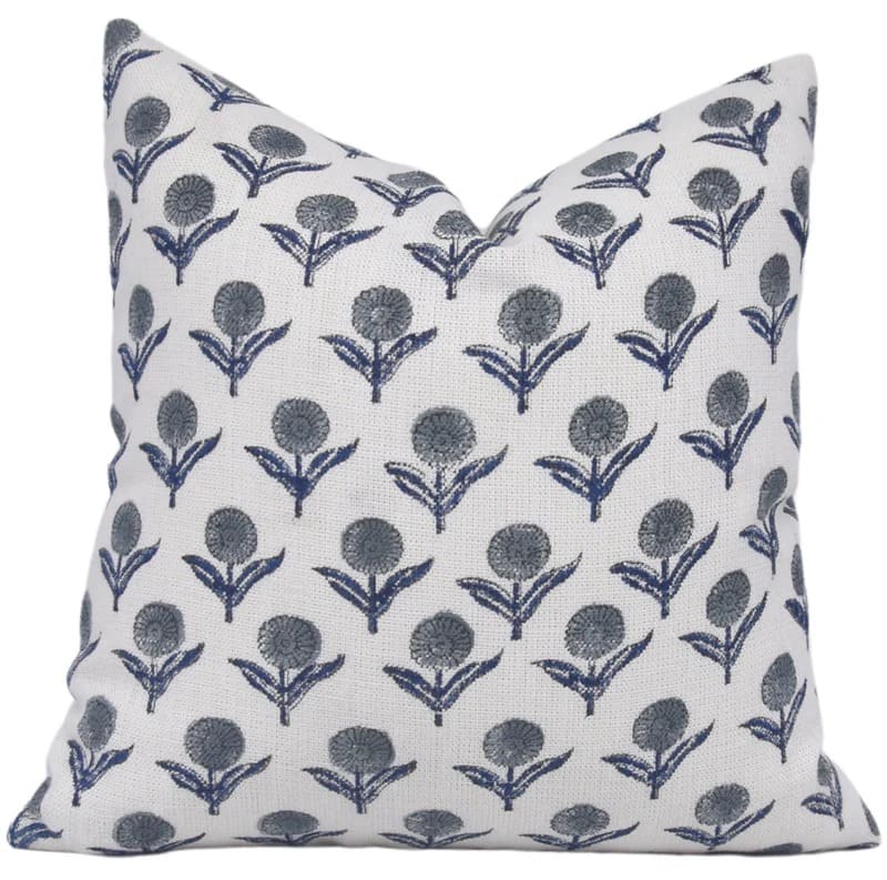 Decorative pillow with blue floral pattern on white background