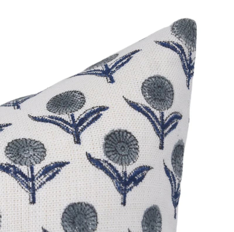 Decorative pillow with blue floral pattern on white background