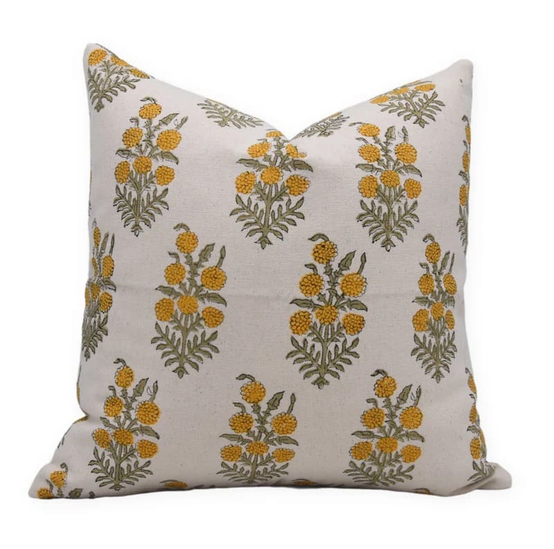 Decorative pillow with floral pattern on a white base fabric with yellow print 