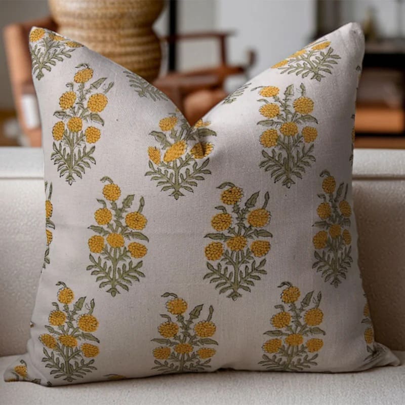 Decorative pillow with floral pattern on a couch