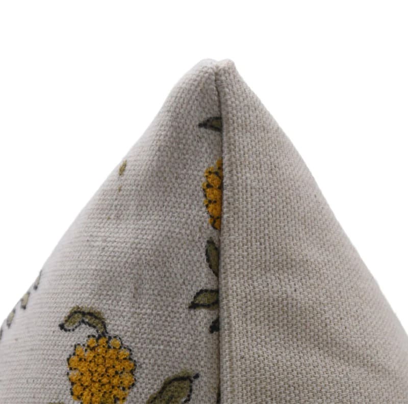 Textured fabric triangle with floral pattern on a white duck canvas fabric