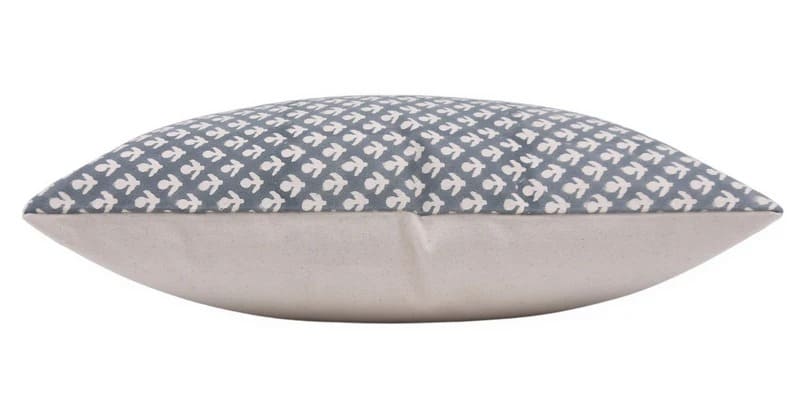 Decorative pillow with blue and white pattern on a white background