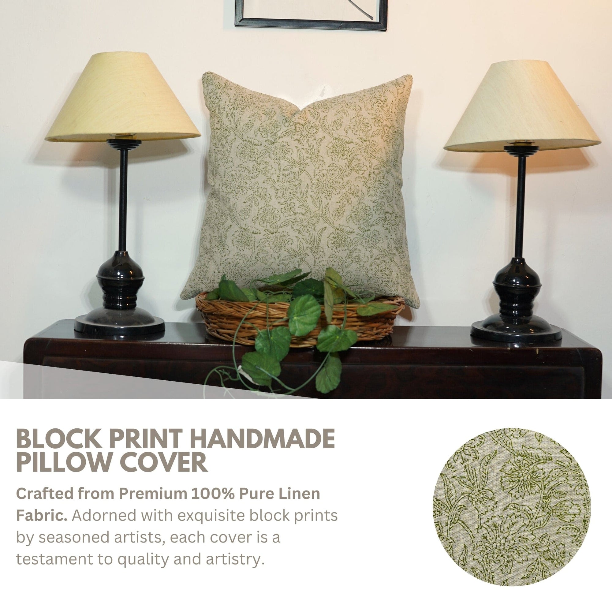 Block print handmade pillow cover on a wooden table with lamps and a plant.