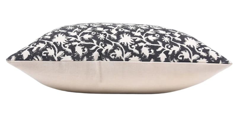 Decorative pillow with black floral pattern on a white duck canvas 