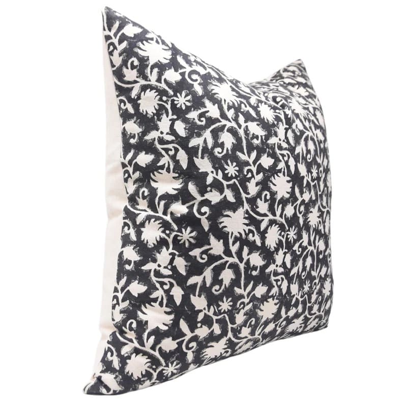 Decorative pillow with black and white floral pattern on a white duck fabric 