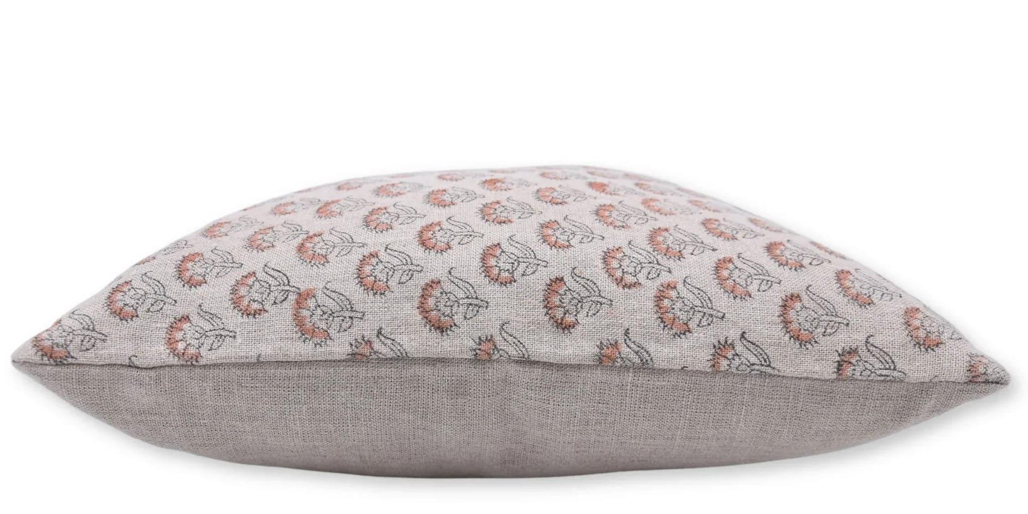 Floral patterned pillow with a plain gray back 