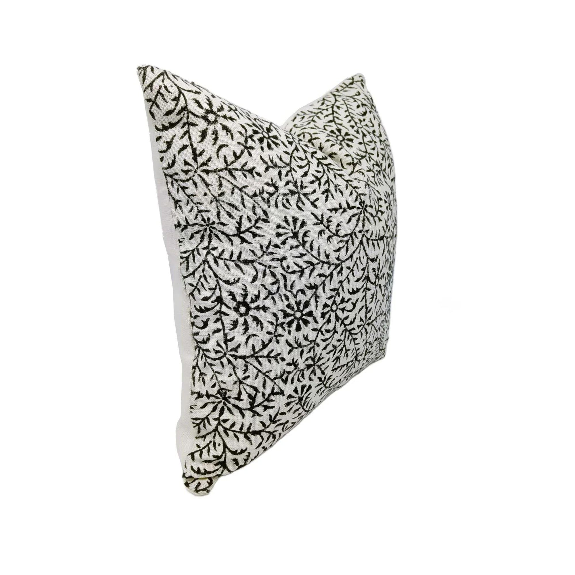 Decorative pillow with black floral pattern 