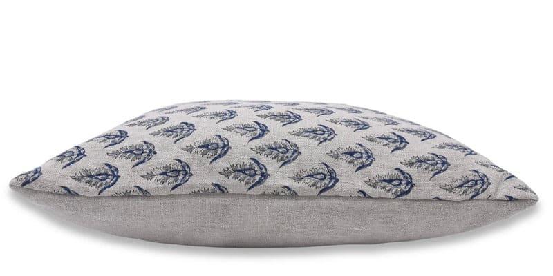 Decorative pillow with blue floral pattern on a grey linen fabric