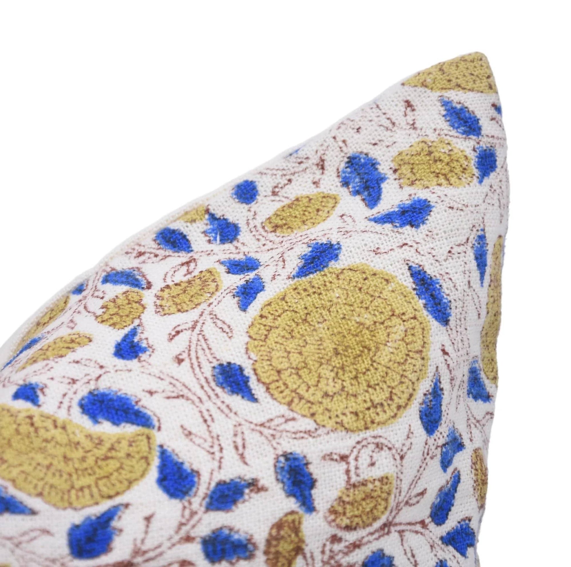 Decorative pillow with blue and gold floral pattern on a white background