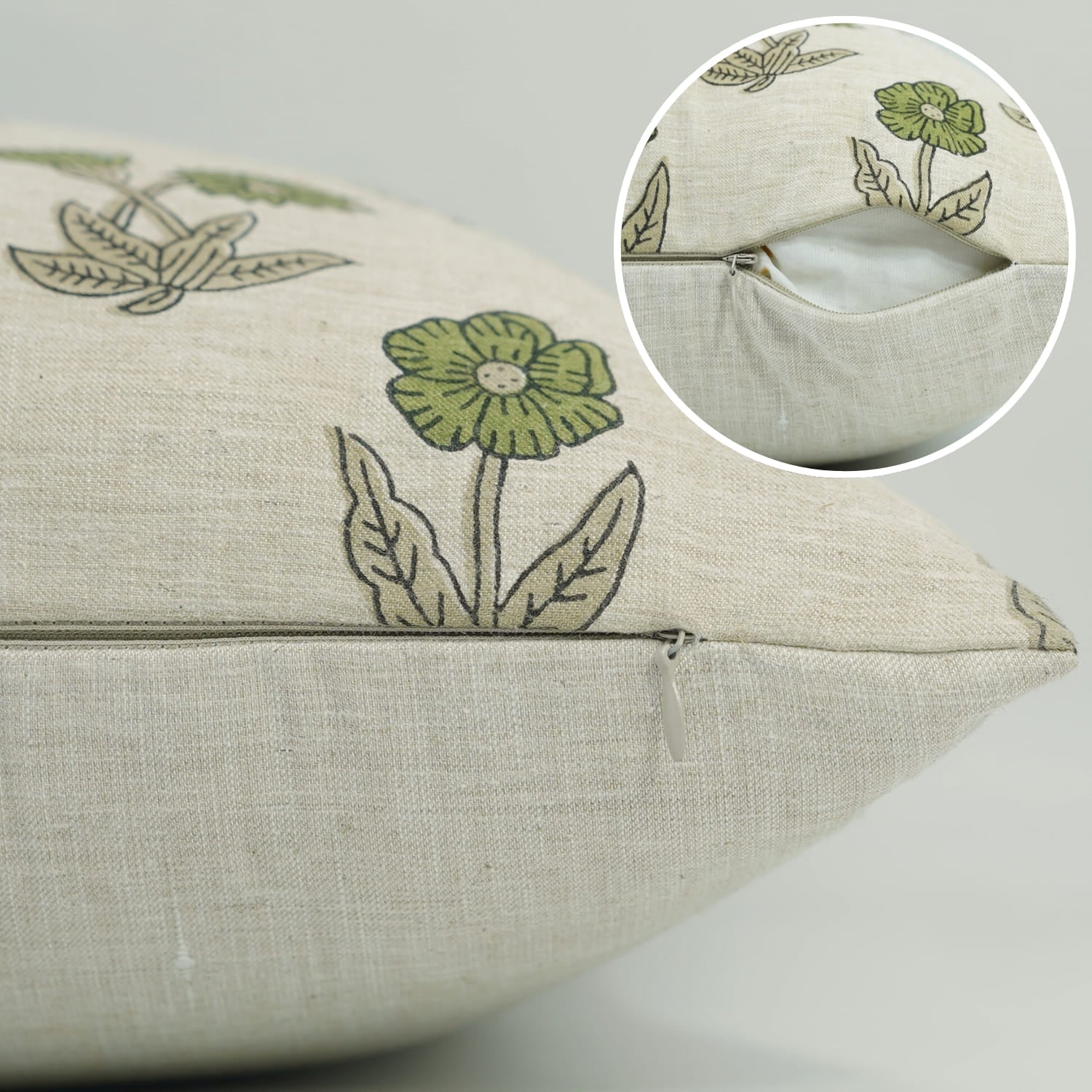Beige pillow with green floral patterns