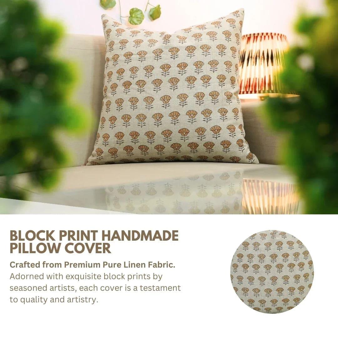 Block print handmade pillow cover on a sofa with decorative elements.