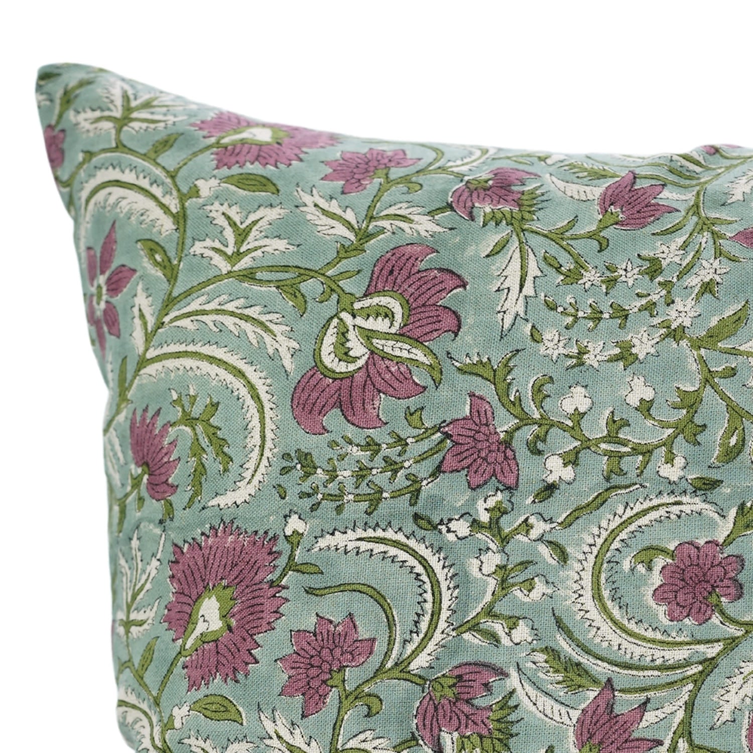 Floral patterned pillow with purple flowers on a light blue