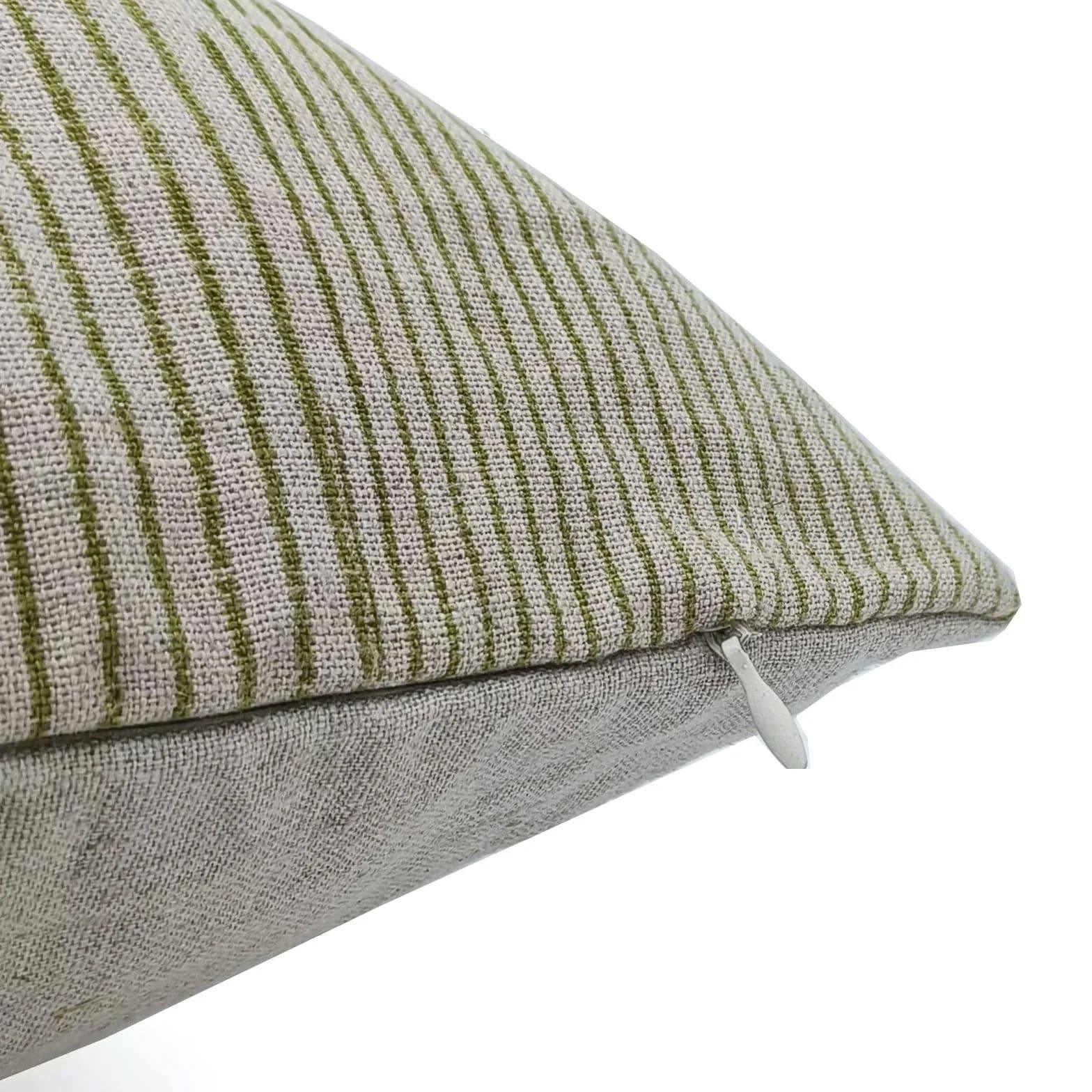 Textured pillow with green and gray stripes on a white background