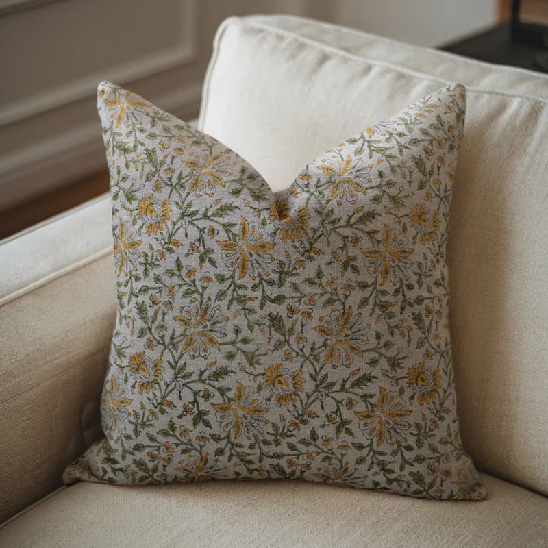 Floral-patterned pillow on a beige sofa

