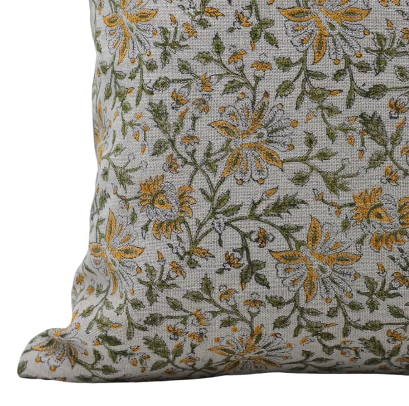 Floral patterned pillow with green and yellow flowers 