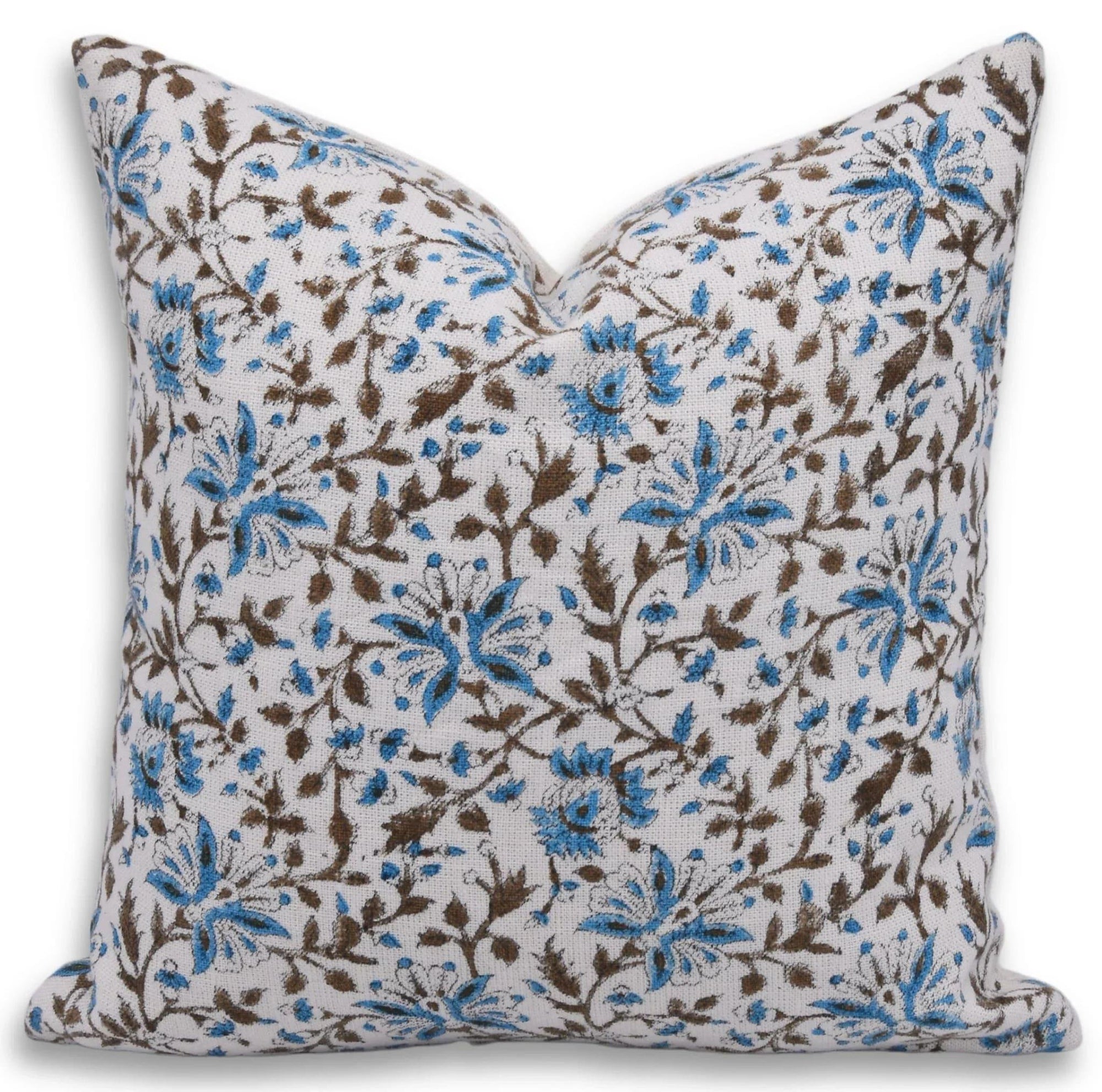 Floral patterned pillow with blue and brown flowers on a white background
