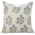 Floral patterned pillow with pink flowers and green leaves 
