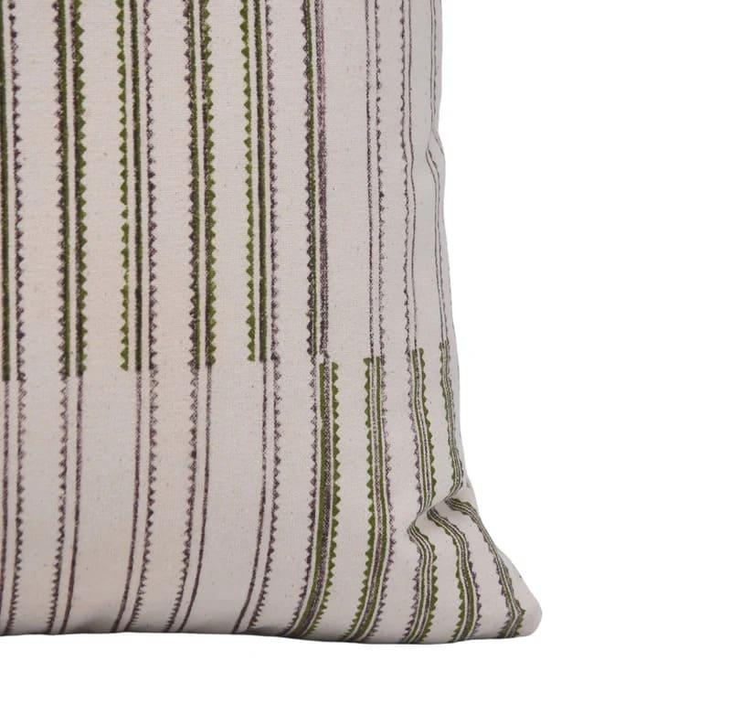 Striped pillow with green and brown pattern on a white background