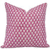 Pink and white patterned pillow on a white background
