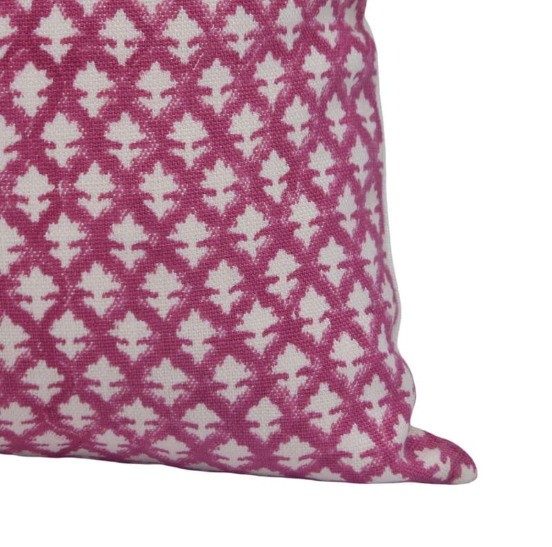 Pink and white patterned pillow on a off white linen fabric 