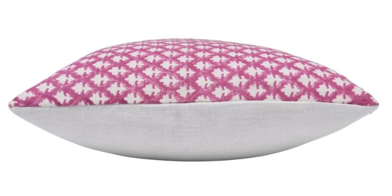 Decorative pillow with pink and white pattern on a white background