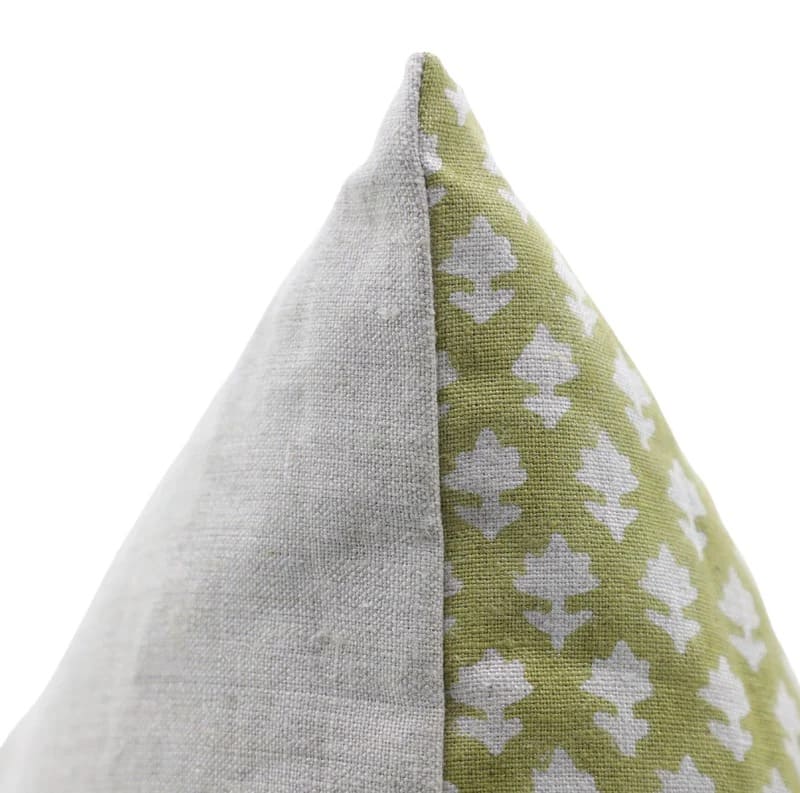 Two fabric triangles, one gray and one with a green pattern, on a white background.