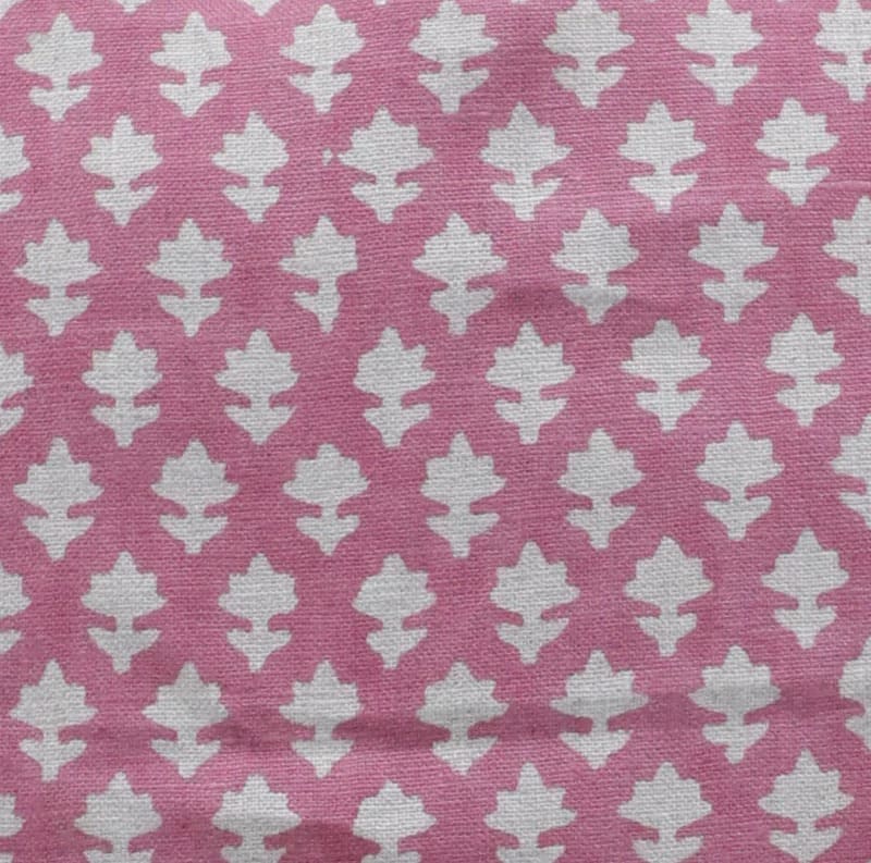 Pink fabric with white leaf pattern