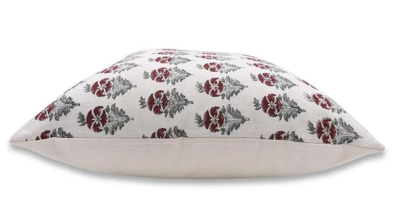 Decorative pillow with floral pattern on a white background