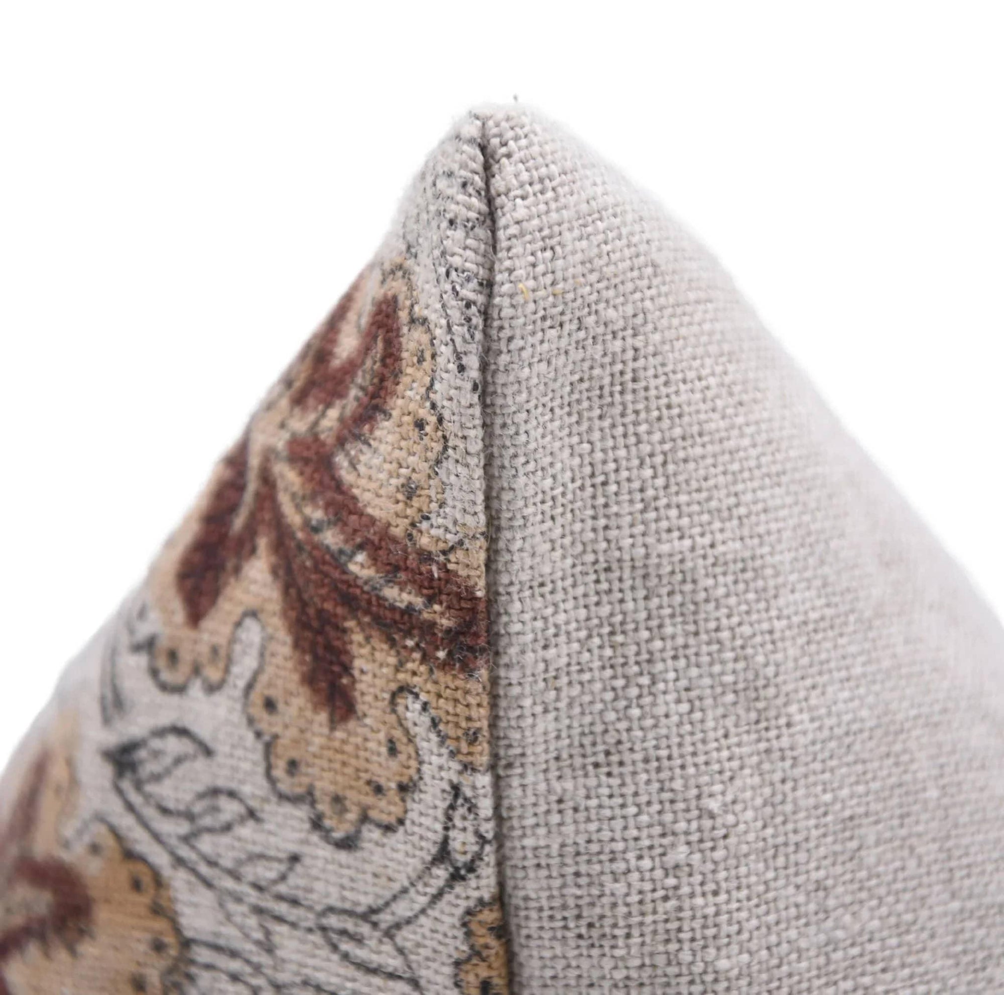 Close-up of a textured fabric surface with a patterned edge.