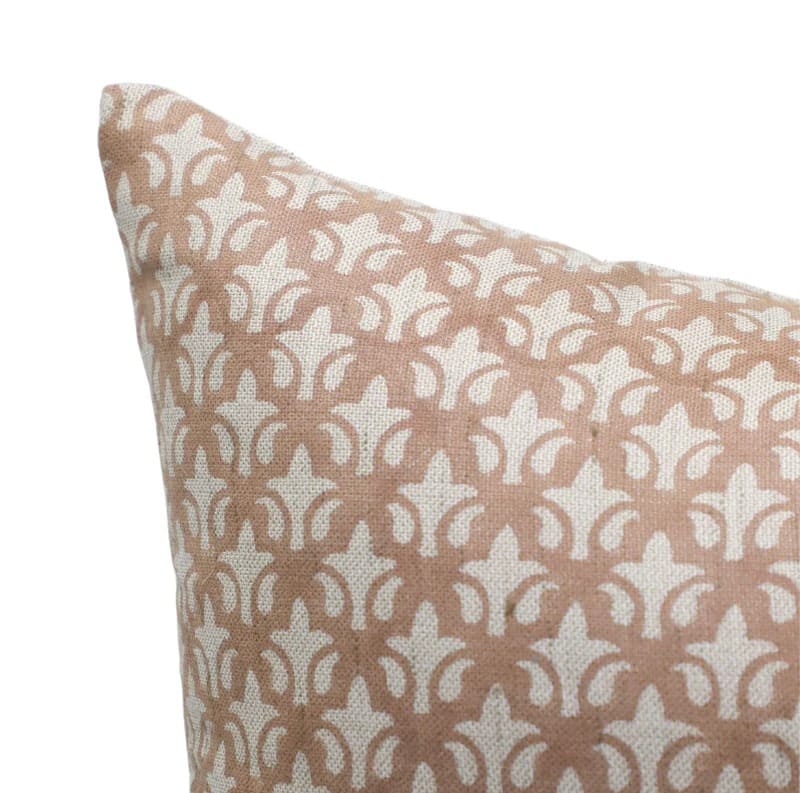Patterned pillow with a star design on a beige background