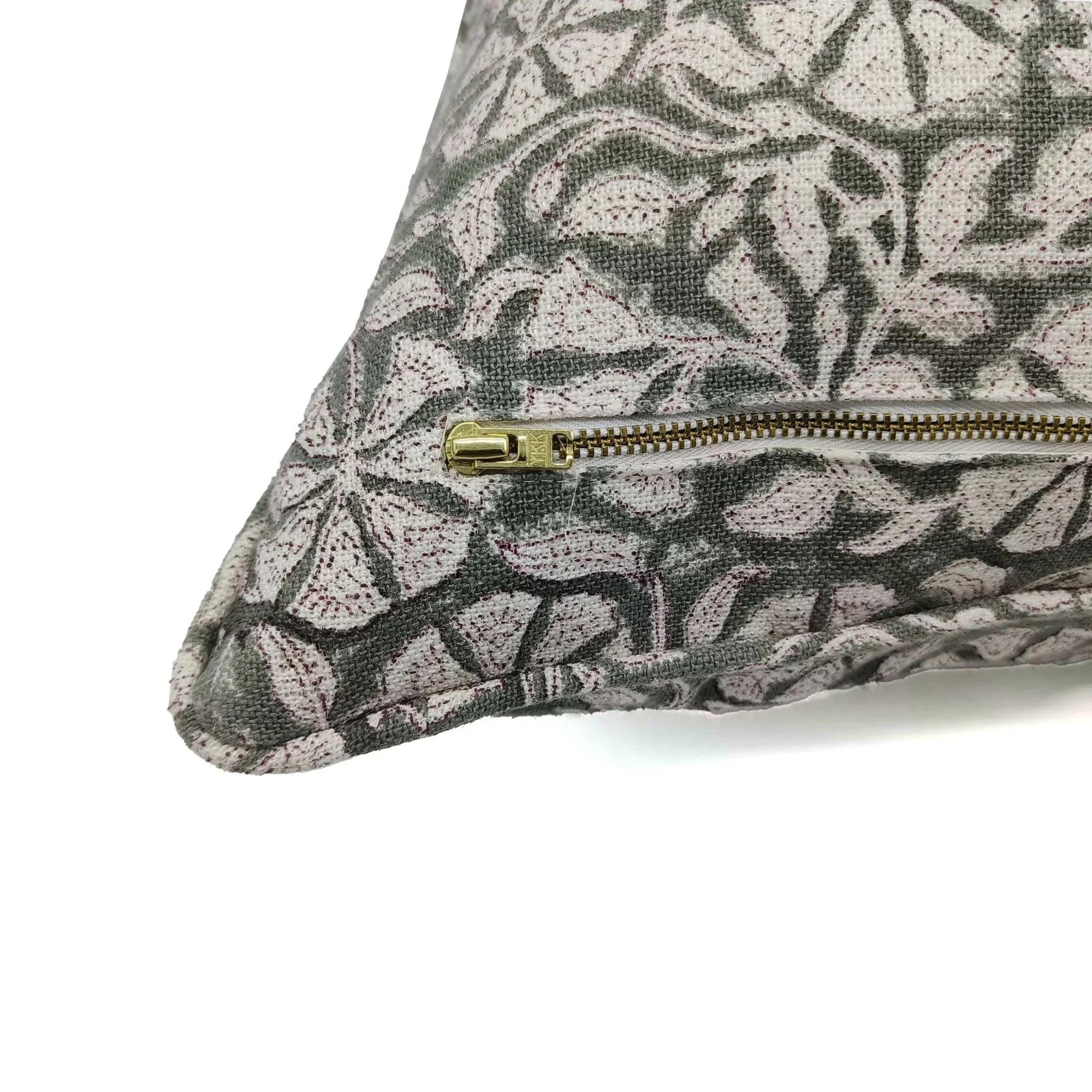 Patterned pouch with a gold zipper on a white background