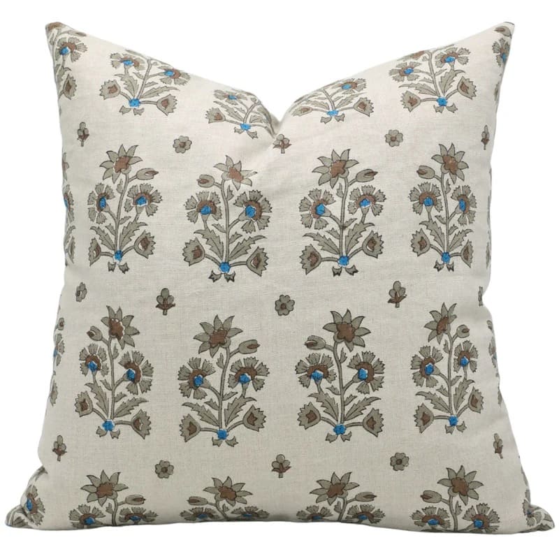 Decorative pillow with floral pattern on a white background